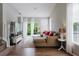Cozy living room with wood floors, natural light, and comfortable seating at 6260 Olivedale Dr, Riverview, FL 33578