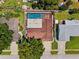 Aerial view of a house with a pool and a large backyard covered by a screen at 6365 32Nd N Ave, St Petersburg, FL 33710