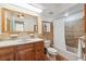 Bathroom featuring a vanity, framed mirror, bathtub and shower combo with tile surround at 6365 32Nd N Ave, St Petersburg, FL 33710