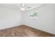 Simple, bright bedroom featuring wood-look floors and ample natural light from a window at 6365 32Nd N Ave, St Petersburg, FL 33710