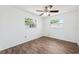 Cozy bedroom with wood-look flooring, two windows, and ample natural light at 6365 32Nd N Ave, St Petersburg, FL 33710