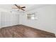 Comfortable bedroom featuring wood-look floors, a window, and a closet with folding doors at 6365 32Nd N Ave, St Petersburg, FL 33710