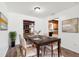Dining room with elegant table and chairs, fireplace, open to the kitchen at 6365 32Nd N Ave, St Petersburg, FL 33710