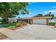 Charming single-story brick home with attached garage, manicured lawn and landscape at 6365 32Nd N Ave, St Petersburg, FL 33710