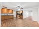 Open-concept kitchen with light wood cabinetry, wood-look floors, and ample counter space at 6365 32Nd N Ave, St Petersburg, FL 33710