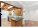 Charming kitchen with wood cabinets and breakfast bar that opens to a dining area at 6365 32Nd N Ave, St Petersburg, FL 33710