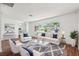 Bright and airy living room featuring plush seating, a large window, and modern decor at 6365 32Nd N Ave, St Petersburg, FL 33710