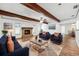 Inviting living room with a stone fireplace, beamed ceilings, and cozy seating arrangement at 6365 32Nd N Ave, St Petersburg, FL 33710