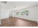 Bright and airy living room featuring a large window with neighborhood views and modern flooring at 6365 32Nd N Ave, St Petersburg, FL 33710