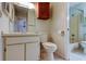 Well-lit bathroom featuring essential fixtures and a mirrored vanity at 6428 Gloria Dr # 21, New Port Richey, FL 34653