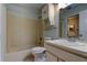 Clean bathroom with a shower-tub combo, single sink vanity, and ample lighting at 6428 Gloria Dr # 21, New Port Richey, FL 34653