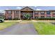 Inviting two-story condo showcasing well-maintained landscaping and convenient parking at 6428 Gloria Dr # 21, New Port Richey, FL 34653