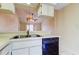 Bright kitchen featuring essential appliances with a view to the living area at 6428 Gloria Dr # 21, New Port Richey, FL 34653