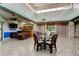 Community lounge featuring a soaring ceiling, comfortable seating, and a convenient kitchenette at 6428 Gloria Dr # 21, New Port Richey, FL 34653