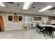 Large recreation room featuring dart boards, and tables at 6428 Gloria Dr # 21, New Port Richey, FL 34653