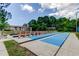 Community shuffleboard courts with seating area and lush landscaping at 6428 Gloria Dr # 21, New Port Richey, FL 34653
