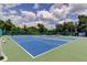 Community tennis courts on a sunny day with clear blue skies at 6428 Gloria Dr # 21, New Port Richey, FL 34653
