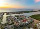 Gorgeous aerial view of the waterfront community showcasing its prime location and stunning sunset scenery at 6604 Dolphin Cove Dr, Apollo Beach, FL 33572