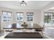 Bright dining room featuring modern table, stylish chairs and bench, and an abundance of natural light and water views at 6604 Dolphin Cove Dr, Apollo Beach, FL 33572