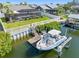 Boat lift with a motorboat, providing easy access to the water and relaxing canal views at 6604 Dolphin Cove Dr, Apollo Beach, FL 33572