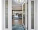 Welcoming foyer with detailed glass front door leading into a spacious living area, perfect for entertaining at 6604 Dolphin Cove Dr, Apollo Beach, FL 33572