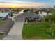 Charming single-story home featuring a well-maintained lawn, attached garage, and inviting curb appeal at 6604 Dolphin Cove Dr, Apollo Beach, FL 33572