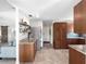 Open concept kitchen featuring stainless steel appliances, granite counters, and access to the living area at 6604 Dolphin Cove Dr, Apollo Beach, FL 33572