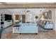 Inviting living room featuring comfortable seating, stylish decor, an entertainment center, and a welcoming atmosphere at 6604 Dolphin Cove Dr, Apollo Beach, FL 33572