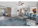 Cozy living room showcasing modern finishes, a sliding barn door, and an open floor plan, creating a relaxing atmosphere at 6604 Dolphin Cove Dr, Apollo Beach, FL 33572