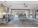 Open-concept living room featuring stylish furnishings, large windows, and water views, ideal for relaxation and gatherings at 6604 Dolphin Cove Dr, Apollo Beach, FL 33572