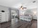 This is a lovely main bedroom featuring a sliding glass door that provides lots of natural light and backyard access at 6604 Dolphin Cove Dr, Apollo Beach, FL 33572