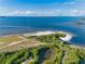 Scenic aerial view of Fred Howard Park featuring sandy beaches and calm waters at 6604 Dolphin Cove Dr, Apollo Beach, FL 33572