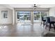 Inviting interior view of the pool and waterfront featuring tile flooring, ceiling fan and access to outdoors at 6604 Dolphin Cove Dr, Apollo Beach, FL 33572