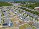 An aerial view of a residential community with modern homes, green spaces and easy access to major thoroughfares at 6653 Mineral Springs Rd, New Port Richey, FL 34653