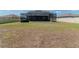 Large backyard featuring screen-enclosed pool and plenty of space at 6653 Mineral Springs Rd, New Port Richey, FL 34653