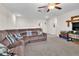 Bonus room with carpeted floor, a comfortable couch and TV for entertainment at 6653 Mineral Springs Rd, New Port Richey, FL 34653