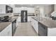 Stylish kitchen featuring granite countertops, stainless steel appliances, and ample cabinet space at 6653 Mineral Springs Rd, New Port Richey, FL 34653