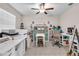Bright office space with a ceiling fan, shelving, and a work area, perfect for productivity at 6653 Mineral Springs Rd, New Port Richey, FL 34653