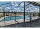 Beautiful screened-in pool area offering relaxation and secure fencing at 6653 Mineral Springs Rd, New Port Richey, FL 34653