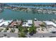 Areal view of the single-Gathering home showcasing waterfront views and tropical landscaping at 860 Harbor Is, Clearwater Beach, FL 33767