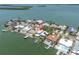 Stunning aerial view of a waterfront property with a private dock and pool in a beautiful neighborhood at 860 Harbor Is, Clearwater Beach, FL 33767