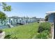 Well-maintained lawn with a view of the canal and the property's private dock, creating a serene outdoor space at 860 Harbor Is, Clearwater Beach, FL 33767