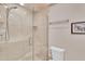 Modern bathroom featuring frameless glass shower and neutral tile at 860 Harbor Is, Clearwater Beach, FL 33767
