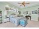 Spacious bedroom with ceiling fan, crown molding and an ample amount of natural light at 860 Harbor Is, Clearwater Beach, FL 33767