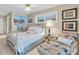 Cozy bedroom with comfortable bed, chair, and natural light from the window at 860 Harbor Is, Clearwater Beach, FL 33767
