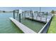 Private boat dock with lifts, offering direct access to the water for boating and water activities at 860 Harbor Is, Clearwater Beach, FL 33767