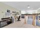 Versatile bonus room with desk, scale model train layout, and neutral decor at 860 Harbor Is, Clearwater Beach, FL 33767