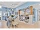 Cozy dining area with decorative chairs, built-in shelving, and natural light; stairs in background at 860 Harbor Is, Clearwater Beach, FL 33767