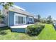 Charming home featuring a well-manicured lawn, outdoor patio, and stylish exterior paint at 860 Harbor Is, Clearwater Beach, FL 33767