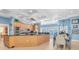 Spacious kitchen featuring modern appliances, a large island with a breakfast bar, and pool views at 860 Harbor Is, Clearwater Beach, FL 33767
